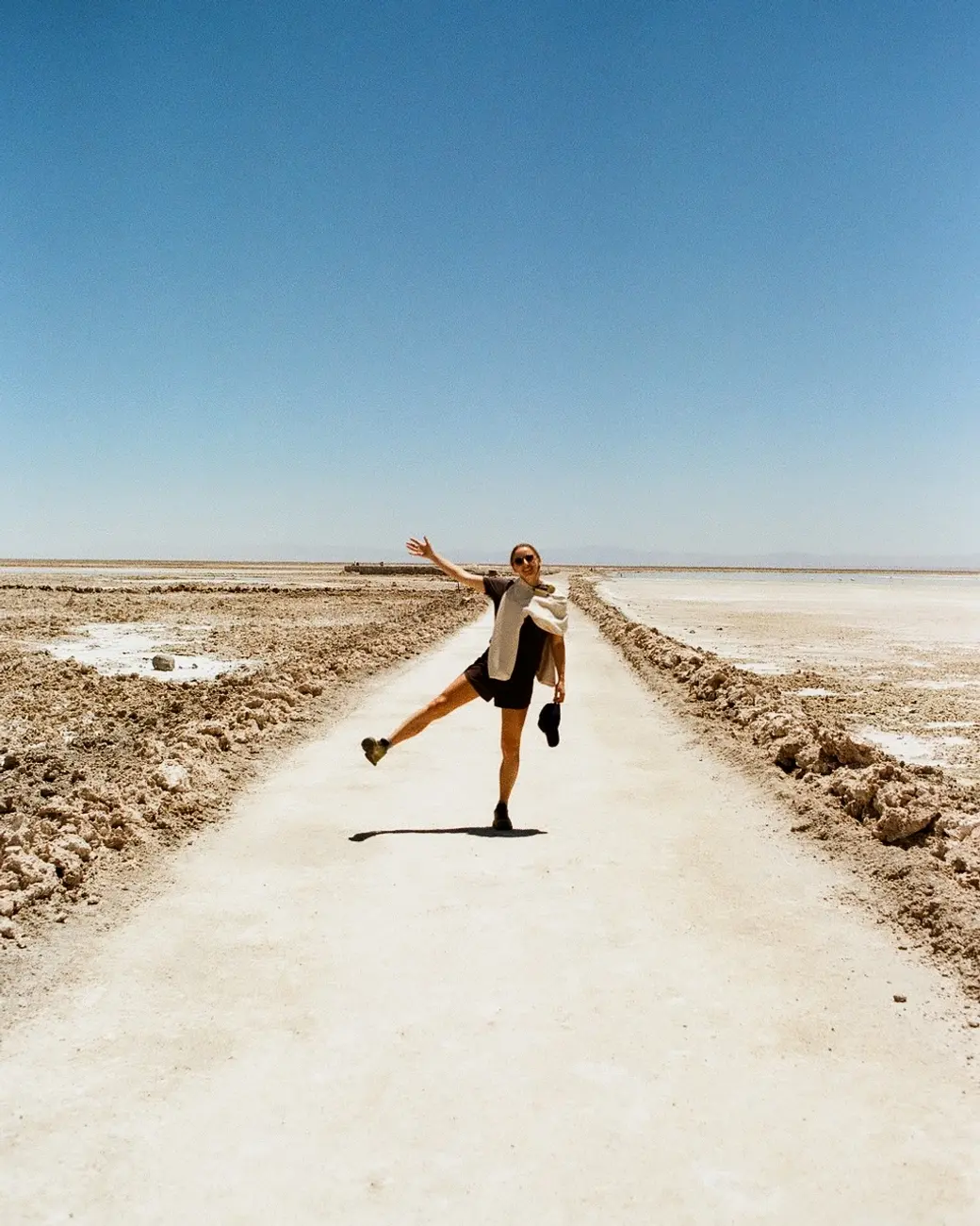 An image a of a person walking in the desert