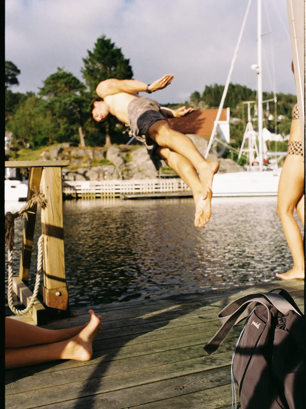 Image of a person jumping off a dock