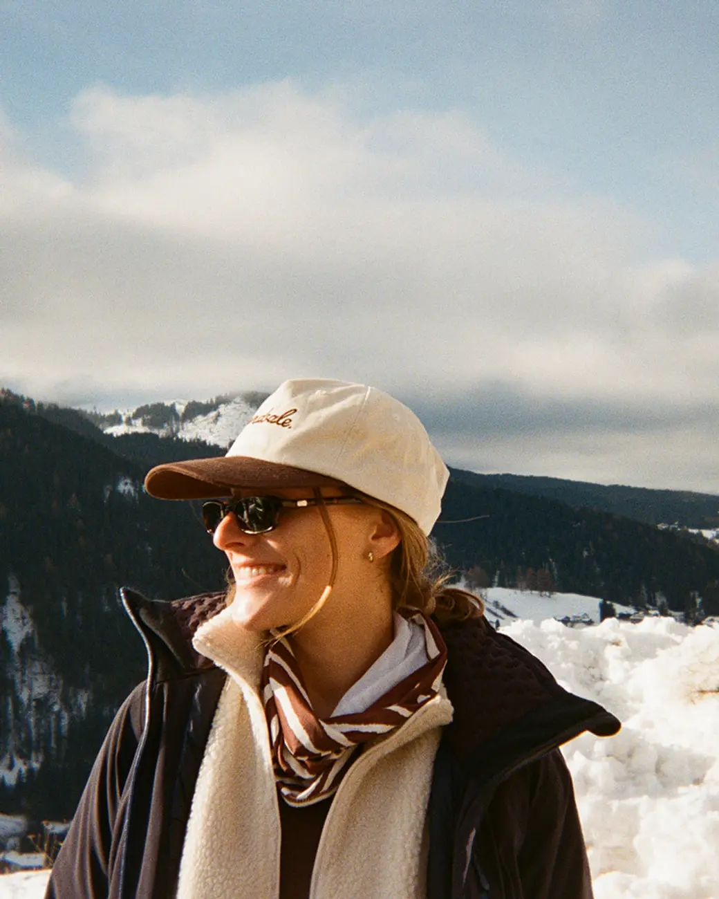 An image a of a person smiling in a Yardsale hat