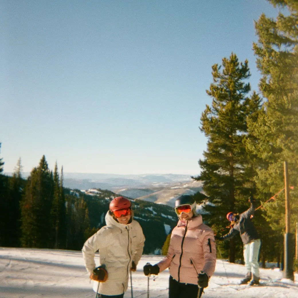 An image of two skiers