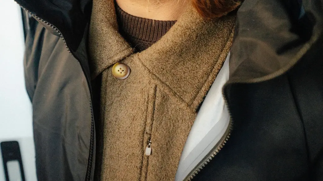 Closeup of sport coat under women's jacket