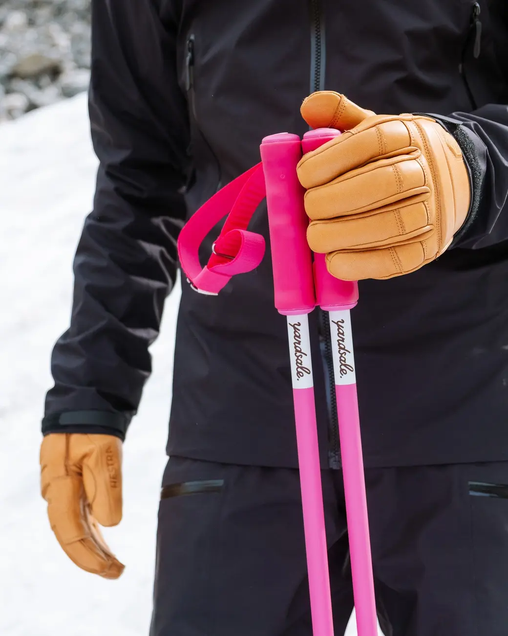 An image of a hand holding poles horizontally