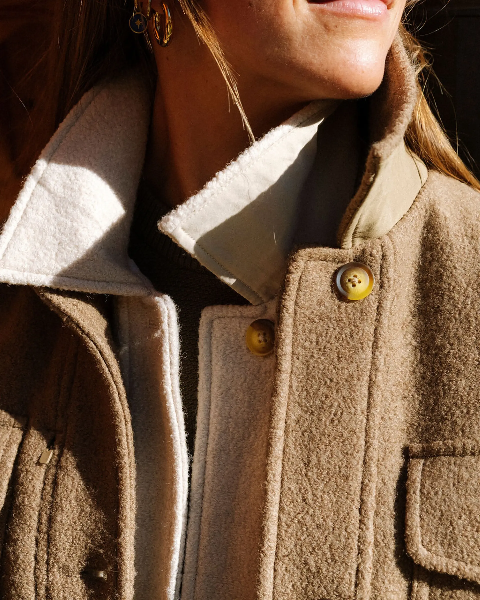 A woman with multiple jackets on