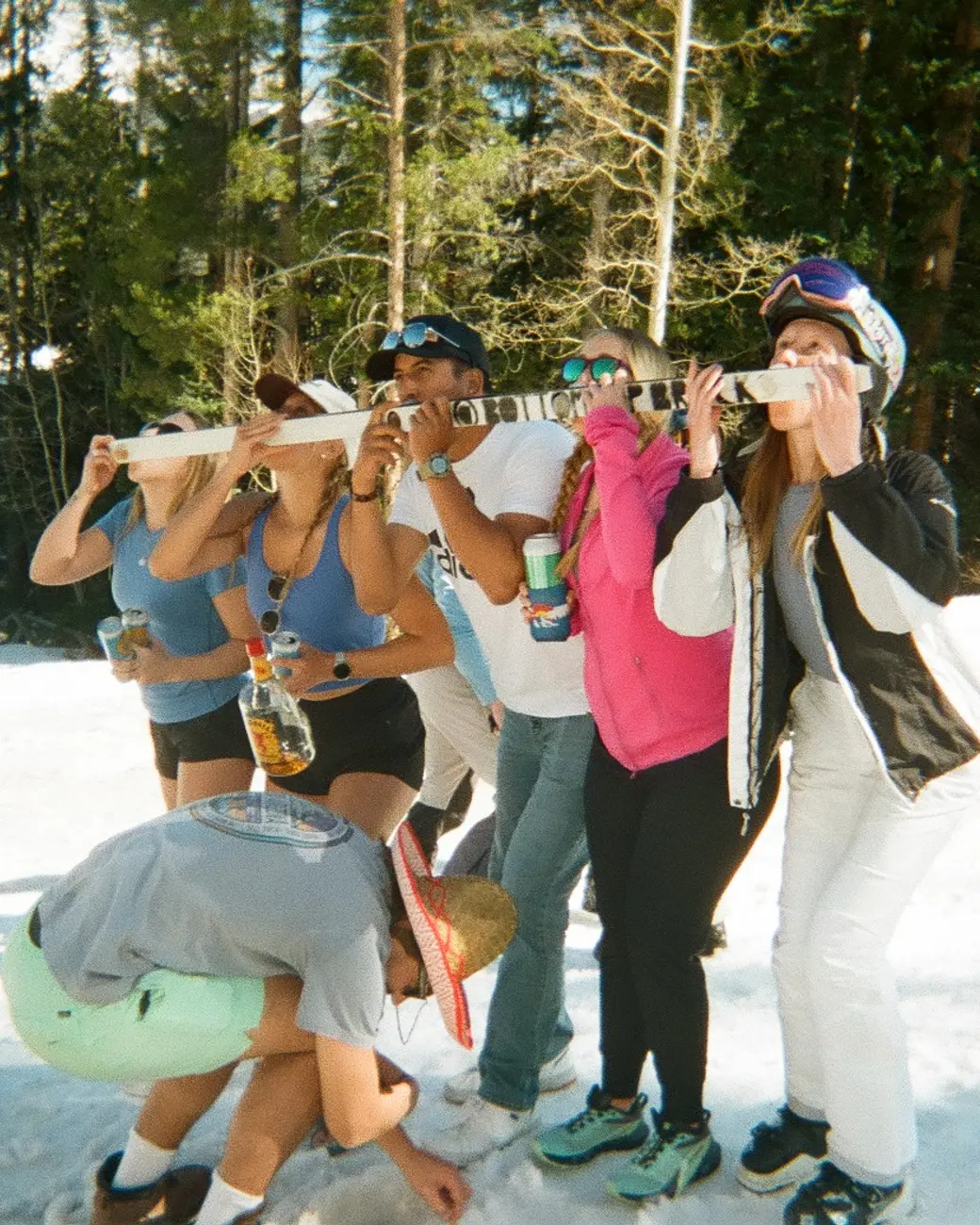An image of friends doing a shotski in Colorado 