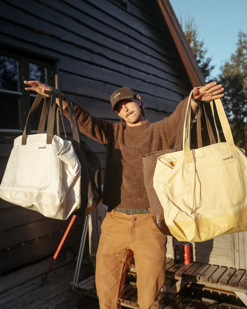 An image a of a person holding day bags on their arm