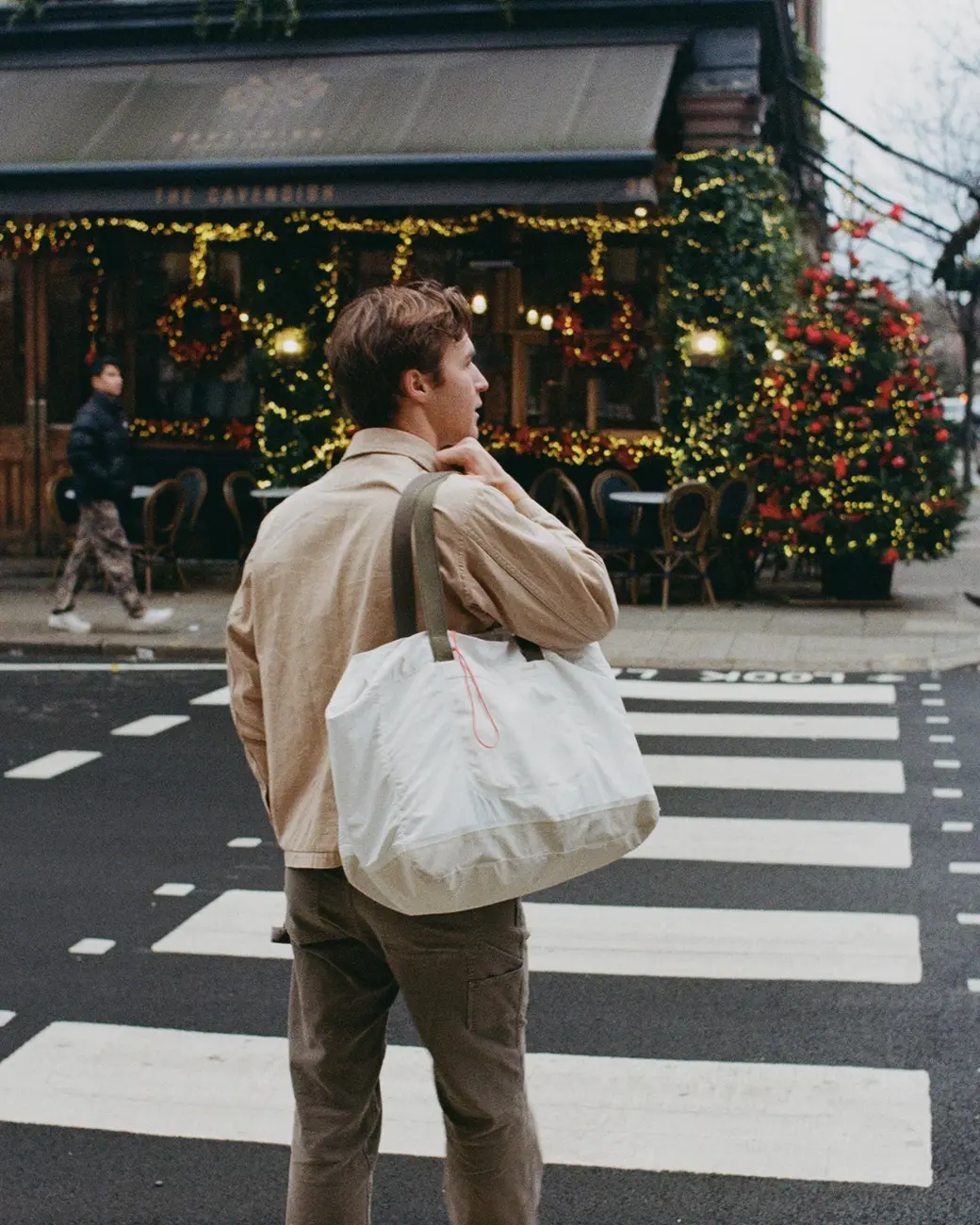 An image a of a person walking across the street in London