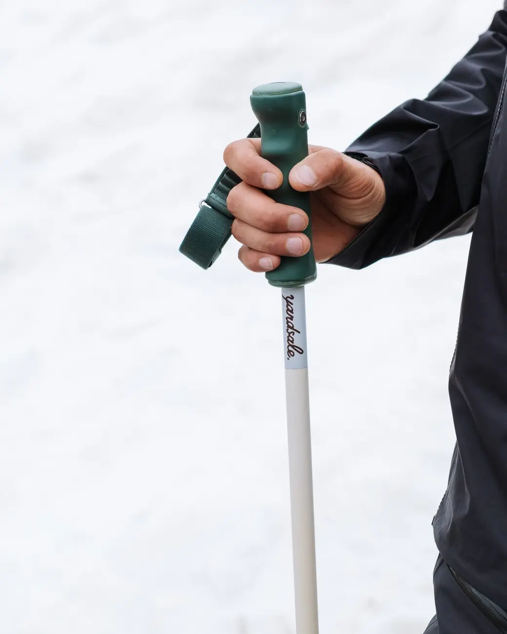 An image of a hand holding poles horizontally