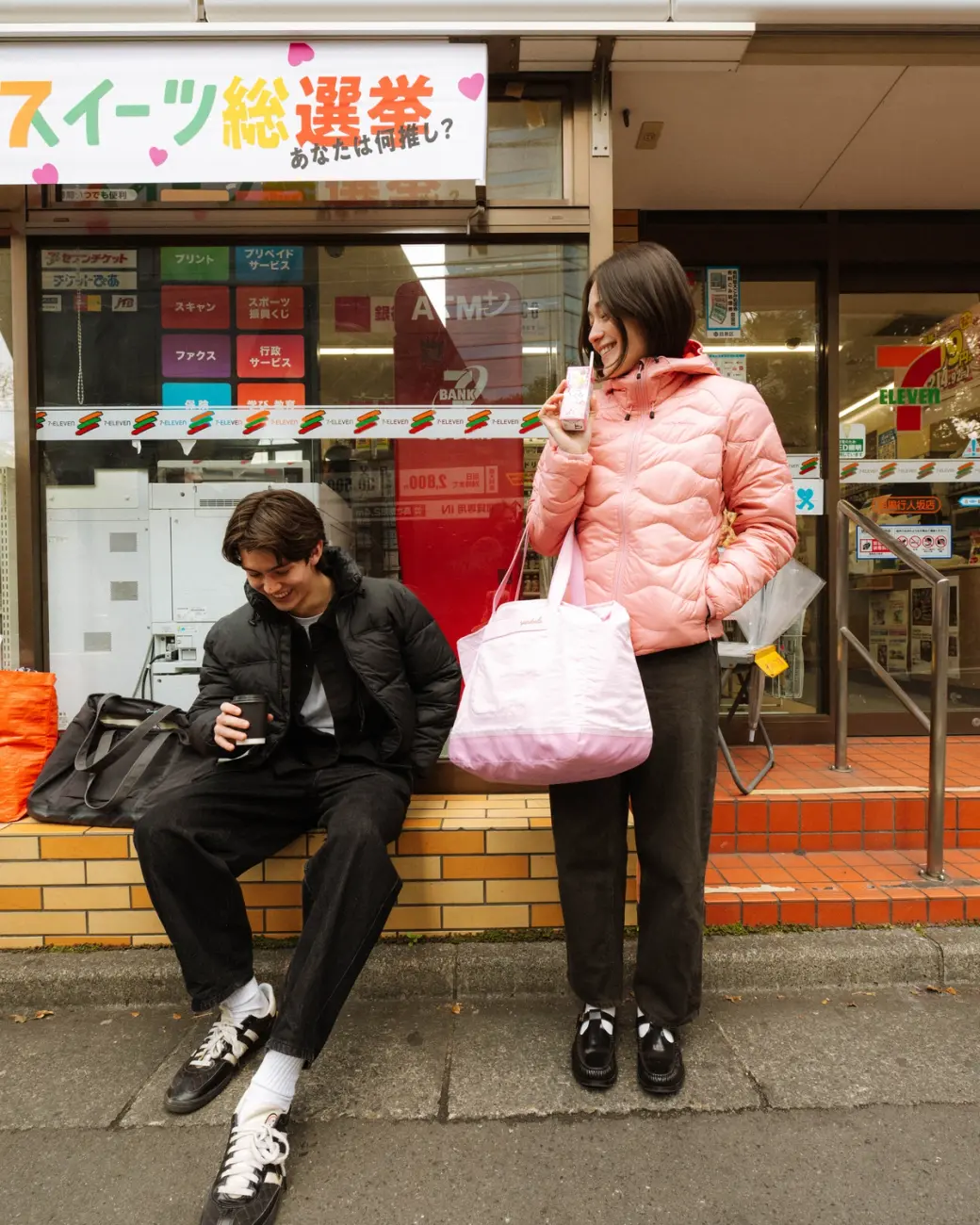 Image of two people outside of a konbini with 20L Day Bags