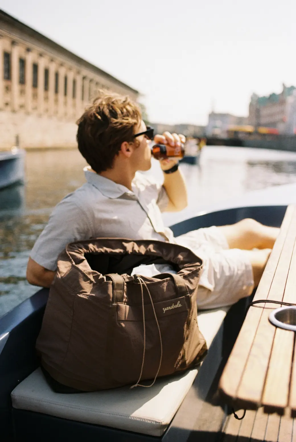 A bag on a boat with a person in the background