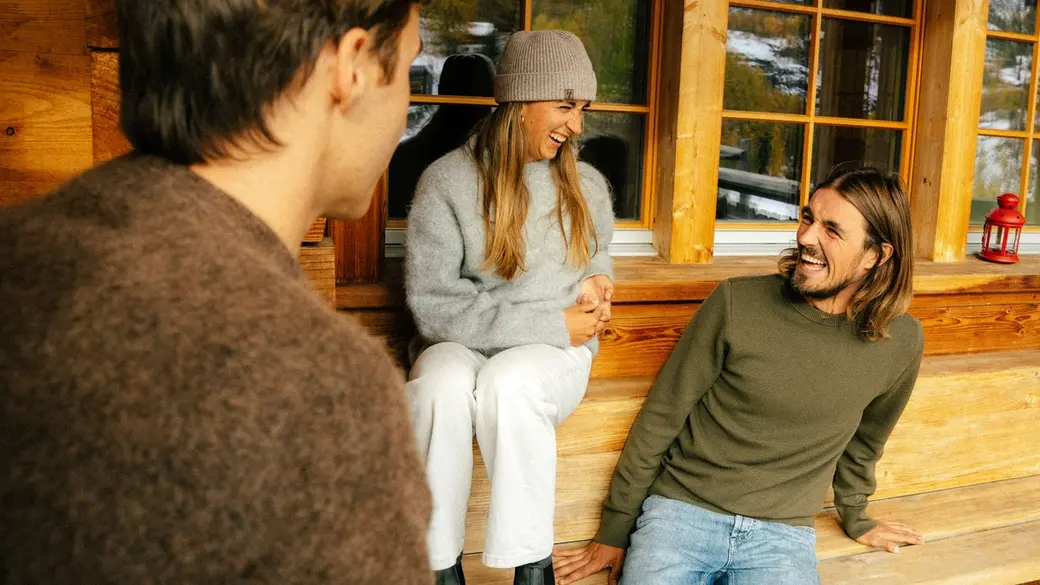 An image of a group of people lounging in a Dinner Sweater
