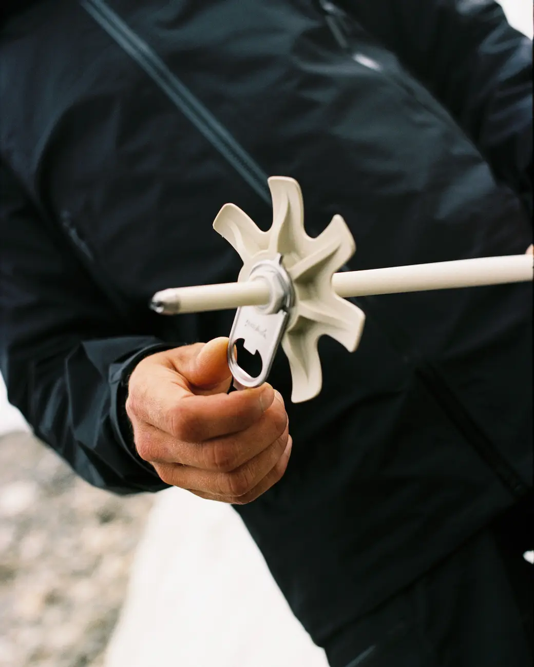 An image of a hand holding poles horizontally